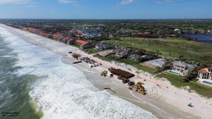 An oblique aerial photograph of the beach fill operations (29-March-2024).