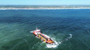 An oblique aerial photograph of the dredge RB Weeks (29-March-2024).